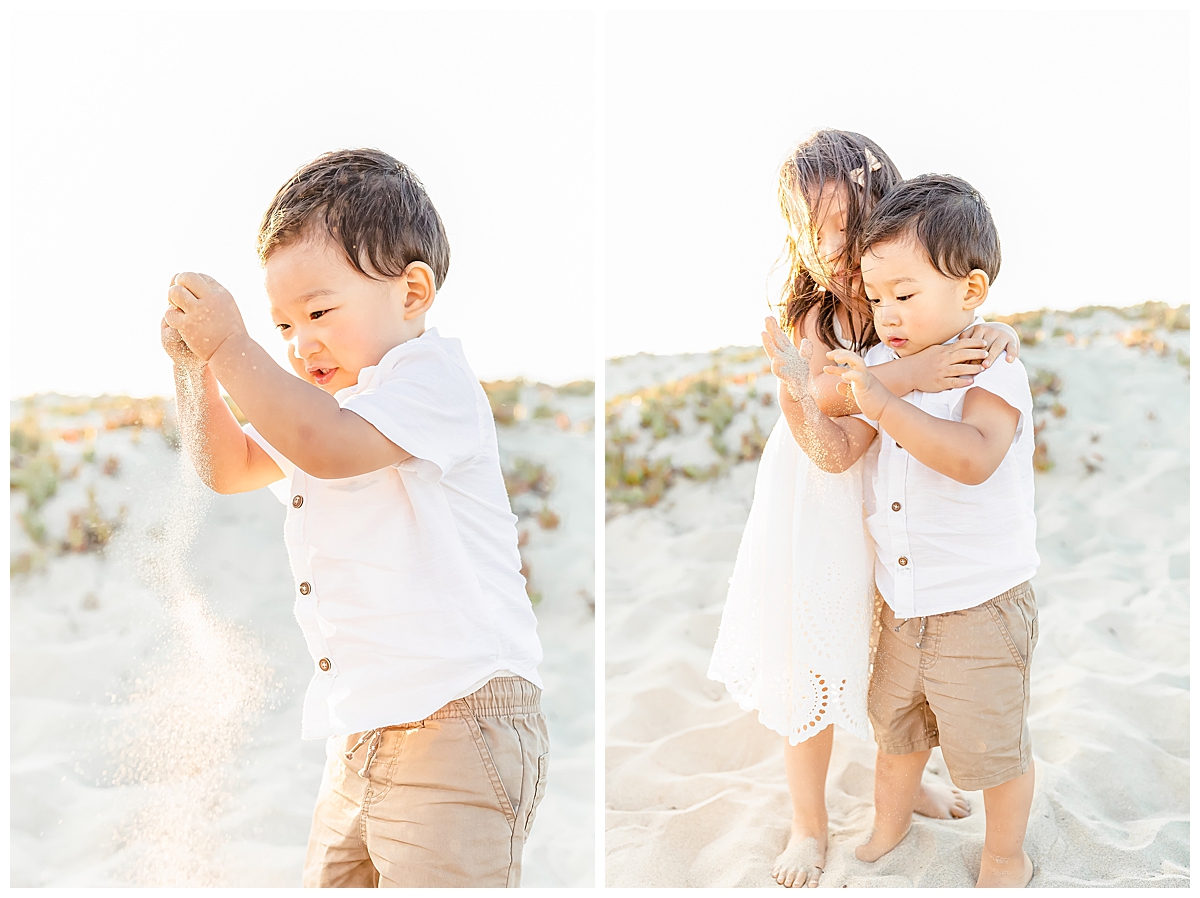 Boy playing with sand while sister hugs him