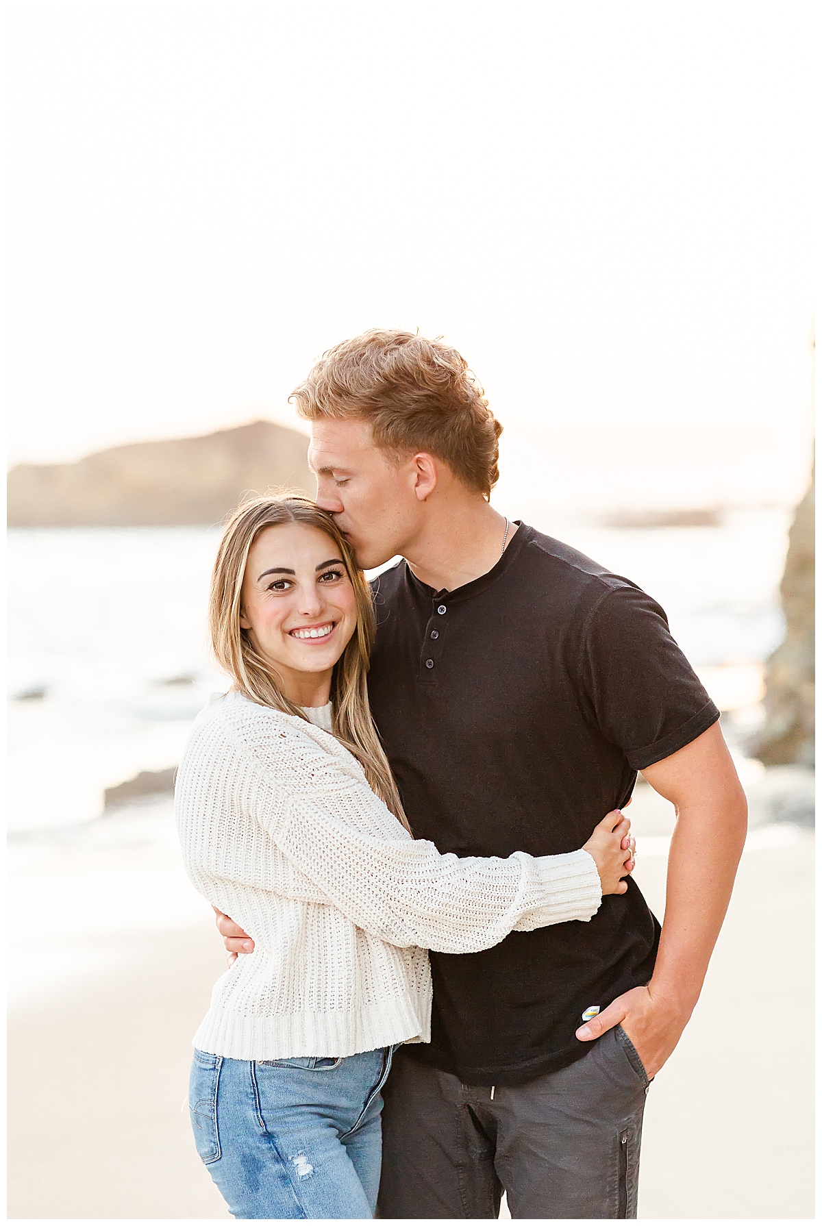 Engaged Couple smiling on the beach