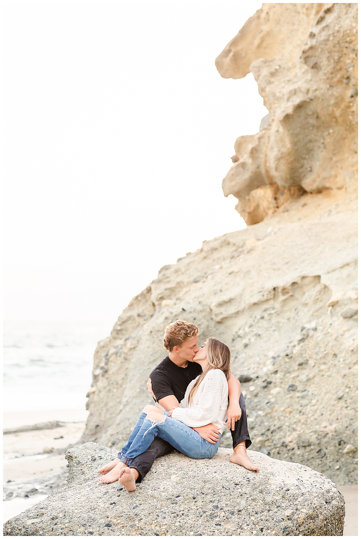 Couple kissing on rock