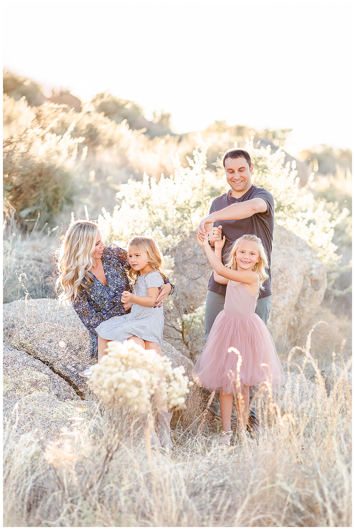 Family dancing in the desert in Scottsdale, AZ photographed by Christine Deaton Creative