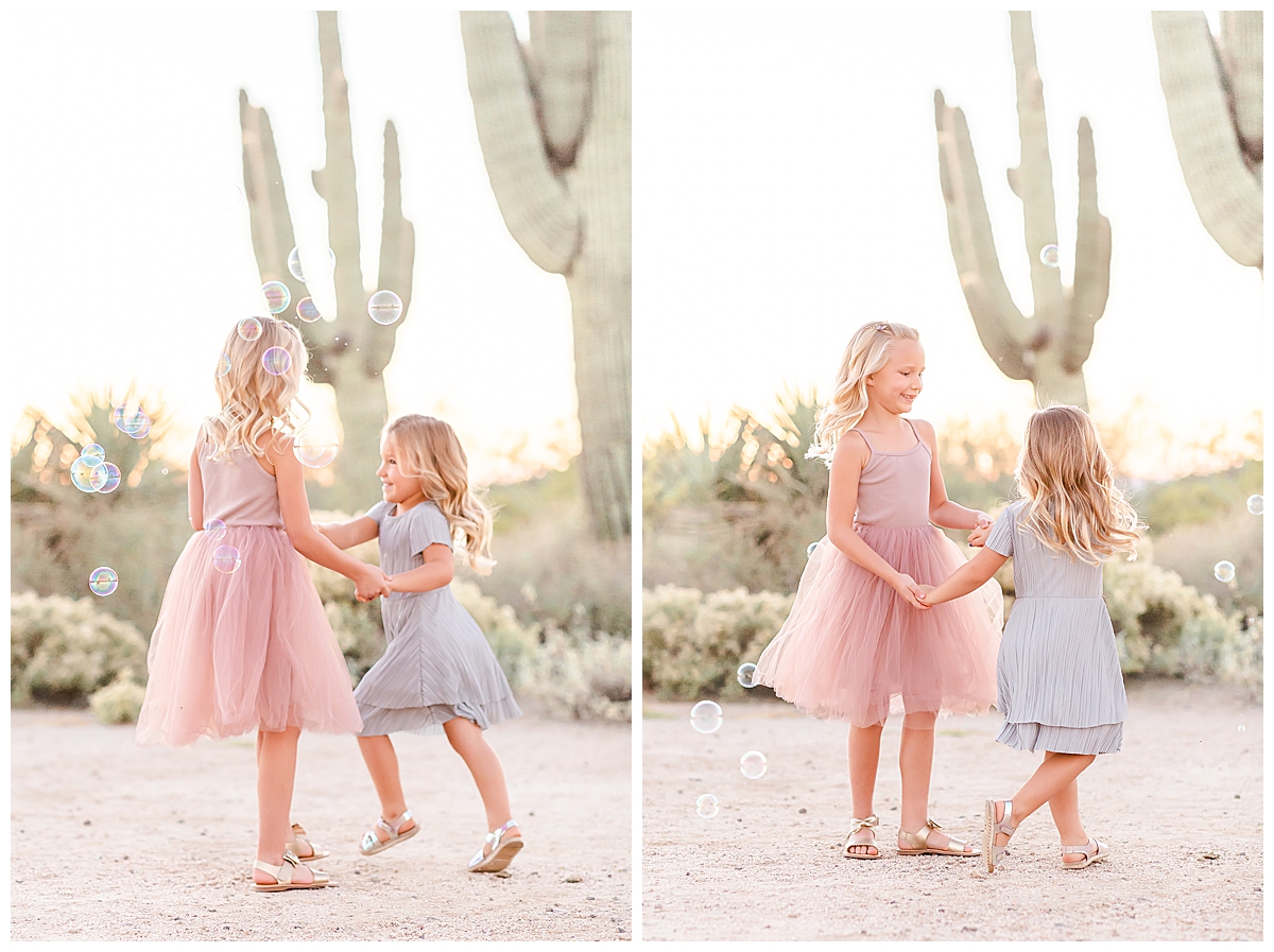 Girls dancing with bubbles in the desert in Scottsdale, AZ photographed by Christine Deaton Creative