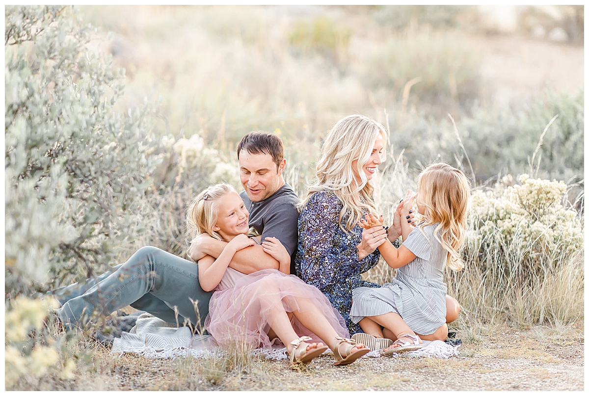 Family playing on picnic blanket in Scottsdale, AZ photographed by Christine Deaton Creative