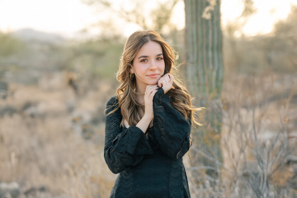 What to wear for senior pictures for girls – Phoenix senior wearing a black lace dress and boots for desert senior photos