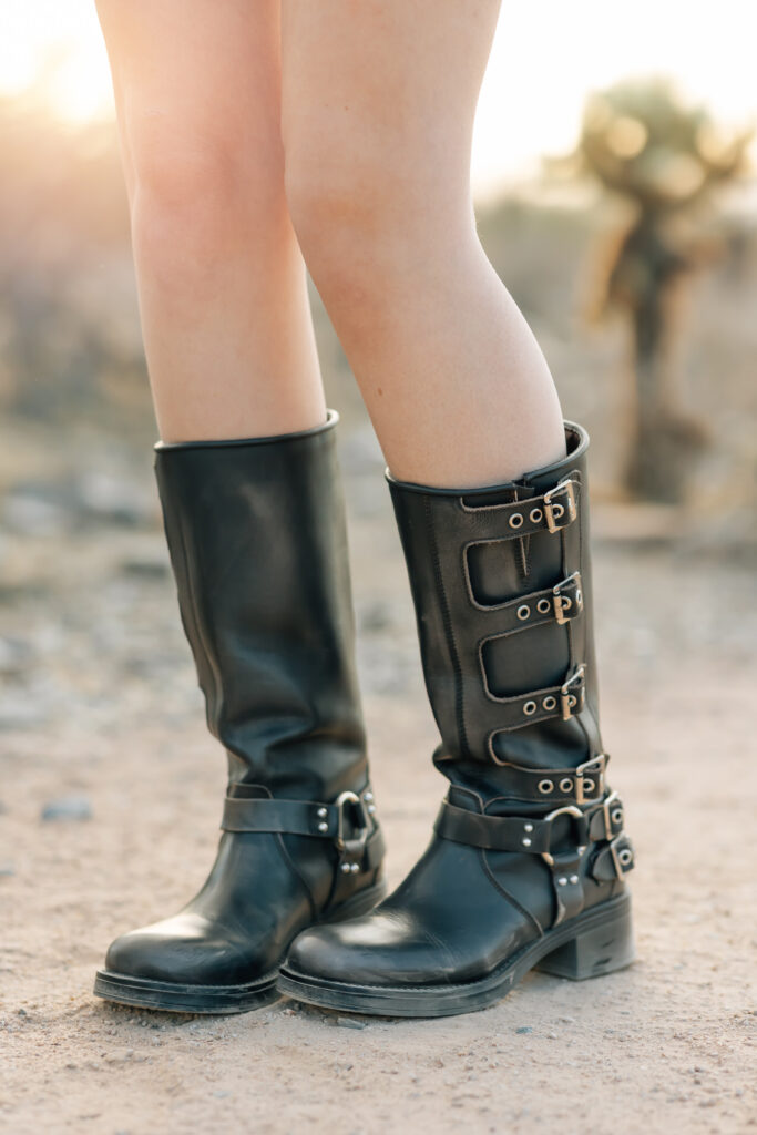 What to wear for senior pictures for girls – Phoenix senior wearing a black lace dress and boots for desert senior photos