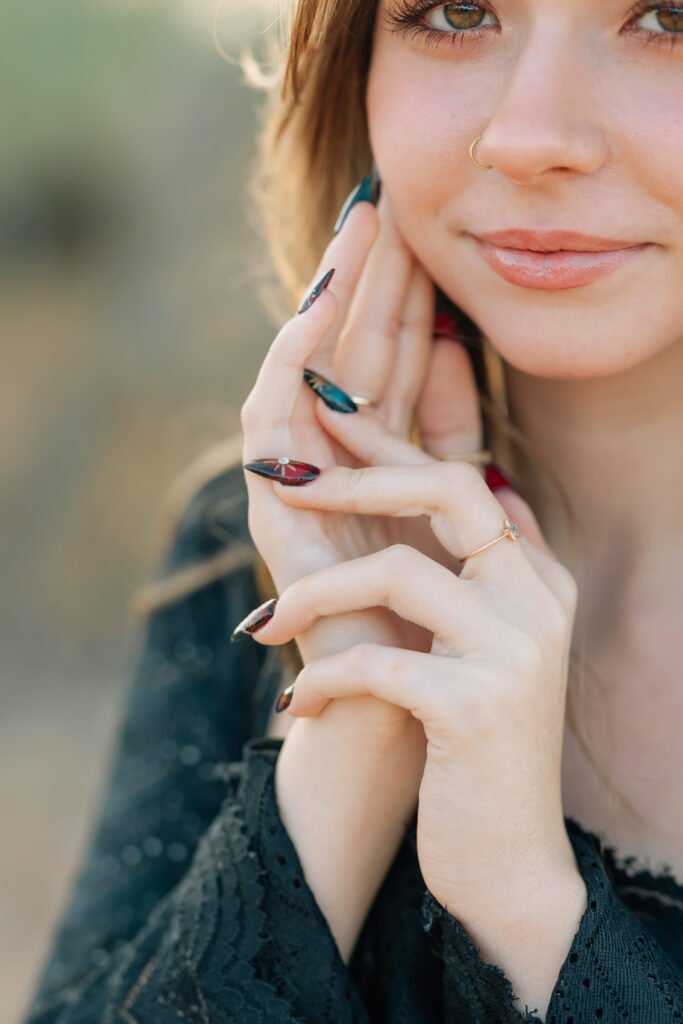What to wear for senior pictures for girls – Phoenix senior wearing a black lace dress and boots for desert senior photos