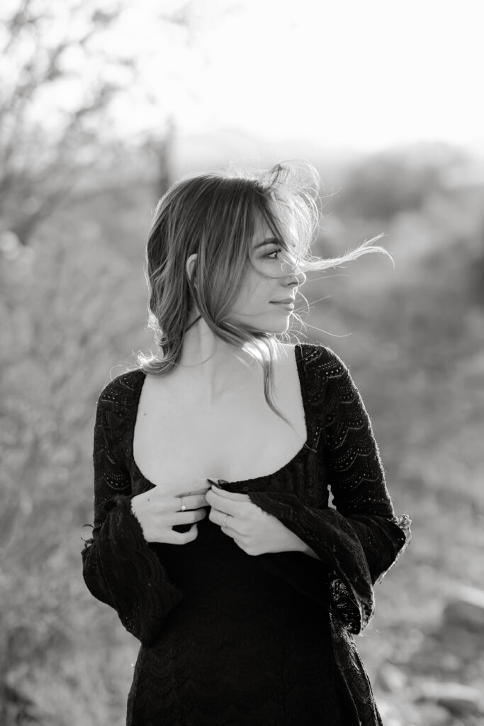 What to wear for senior pictures for girls – Phoenix senior wearing a black lace dress and boots for desert senior photos