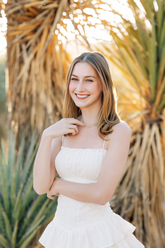 What to wear for senior pictures for girls – Scottsdale senior wearing a white dress and boots for desert senior photos