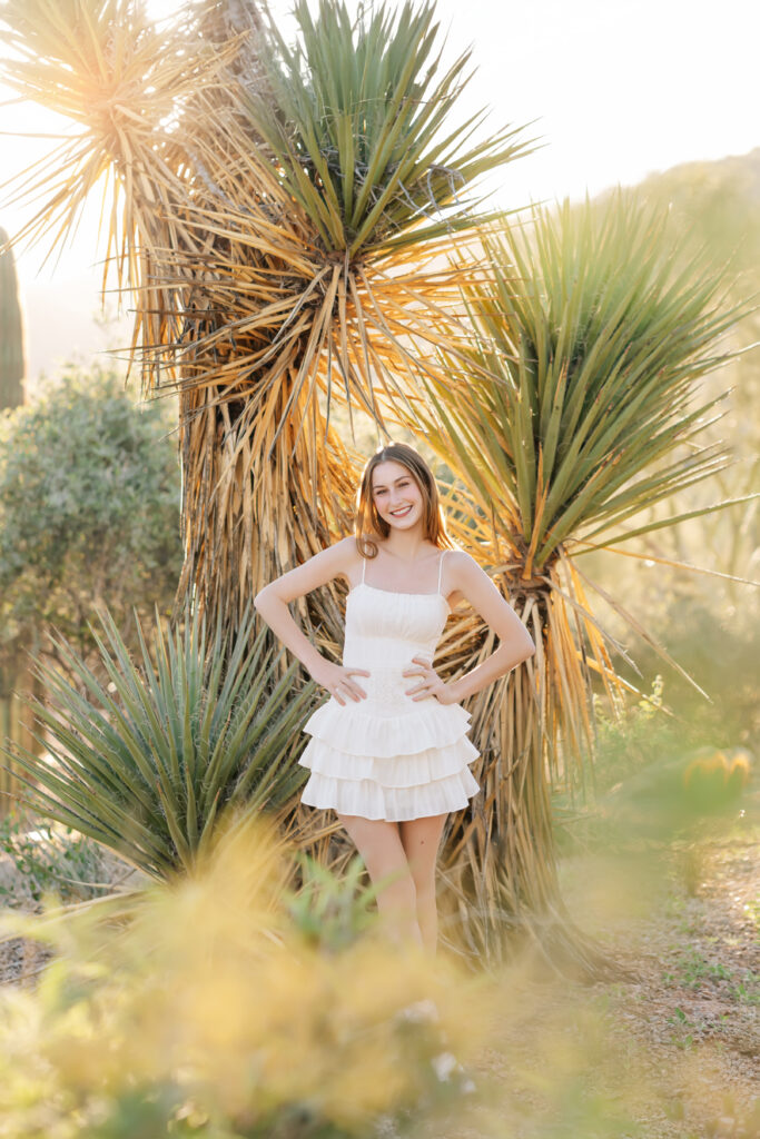 What to wear for senior pictures for girls – Scottsdale senior wearing a white dress and boots for desert senior photos