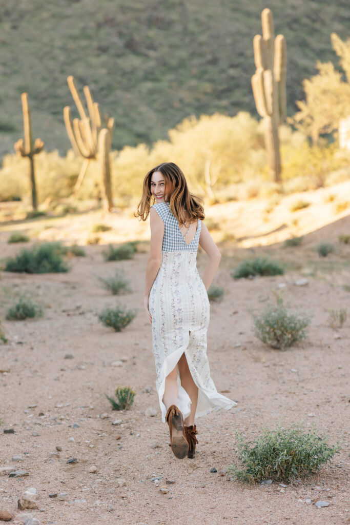 What to wear for senior pictures for girls – Scottsdale senior wearing an Anthropologie inspired dress and short brown boots for desert senior photos