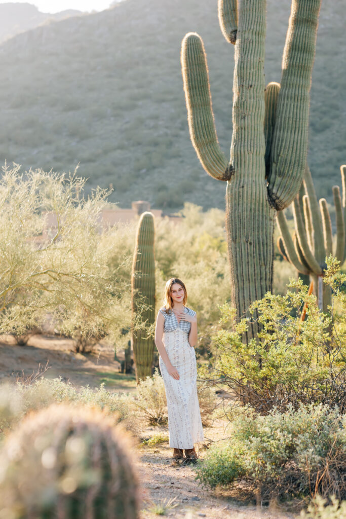 What to wear for senior pictures for girls – Scottsdale senior wearing an Anthropologie inspired dress and short brown boots for desert senior photos